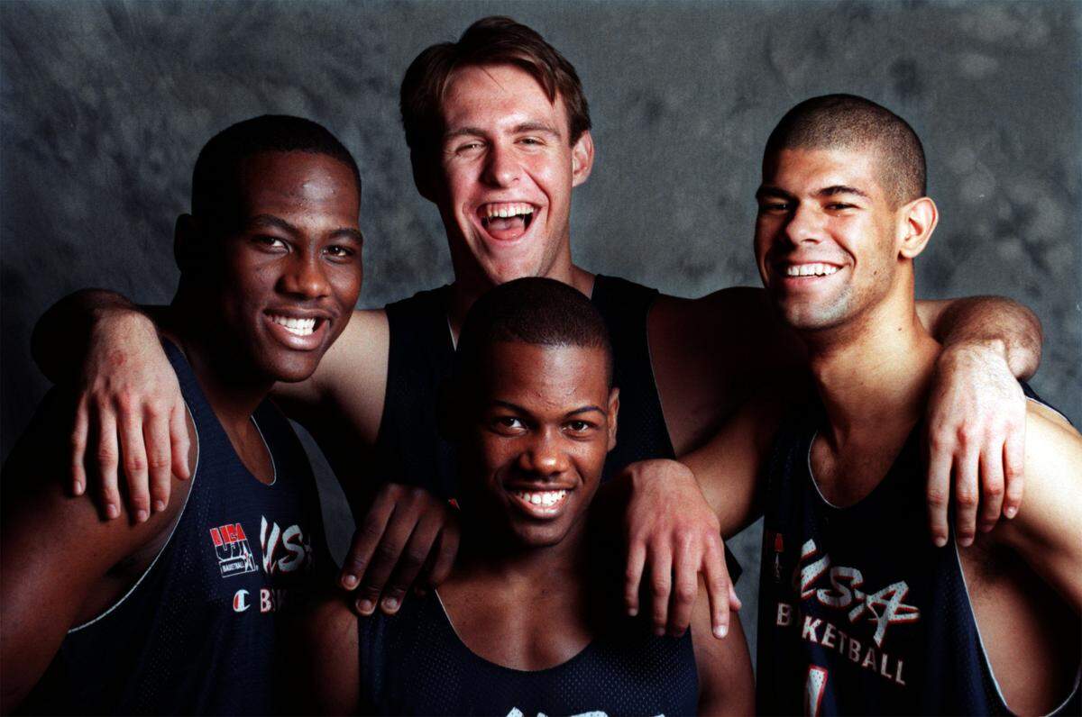 Duke’s Chris Burgess wraps his arms around fellow freshmen Elton Brand, William Avery and Shane Battier, the nation’s top-rated recruiting class in 1997.