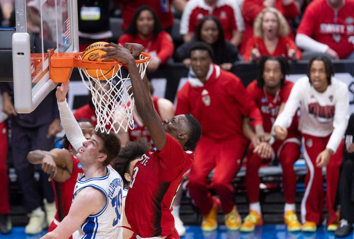 N.C. State’s Mohamed Diarra (23) dunks over Duke’s Kyle Filipowski (30) in the second half during the NCAA South Regional final on Sunday, March 31, 2024 at the American Airlines Center in Dallas, Texas.
