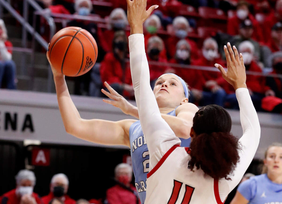 North Carolina’s Carlie Littlefield (2) shoots as N.C. State’s Jakia Brown-Turner (11) defends during the first half of N.C. State’s game against UNC at Reynolds Coliseum in Raleigh, N.C., Thursday, January 6, 2022.
