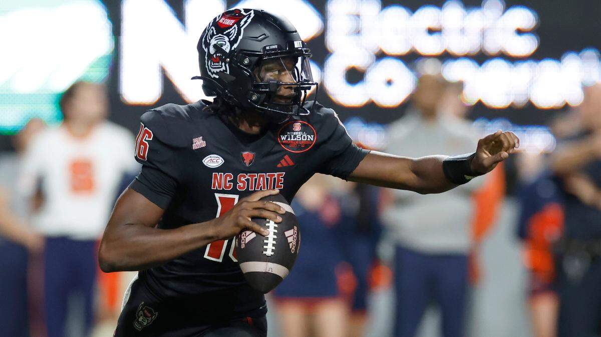 N.C. State quarterback CJ Bailey (16) looks for a receiver downfield during the second half of Syracuse’s 24-17 victory over N.C. State at Carter-Finley Stadium in Raleigh, N.C., Saturday, Oct. 12, 2024.