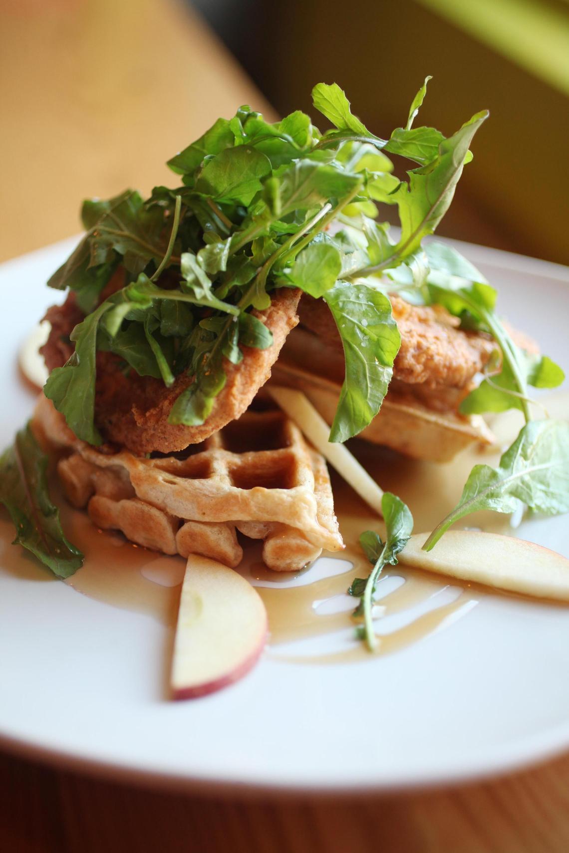 Crispy fried “chicken” and waffles, topped with arugula and agave is a vegan pleaser at Fiction Kitchen in Raleigh. The restaurant is 100% vegetarian with a large and varied vegan menu.