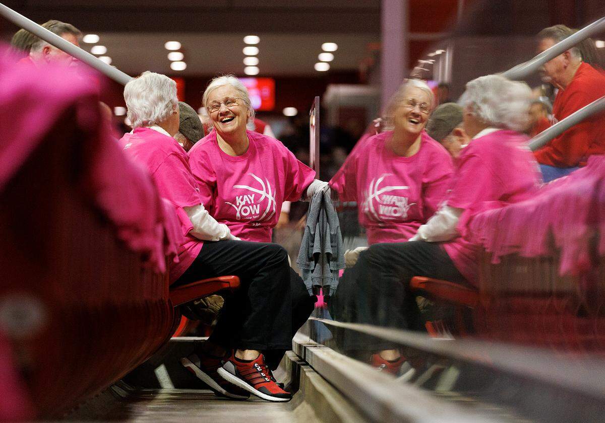 Susan Glover and Gail Biesecker wear shirts to honor former N.C. State head coach Kay Yow prior to the start of the Wolfpack’s Play4Kay Game against Louisville on Monday, Feb. 5, 2024, at Reynolds Coliseum in Raleigh, N.C.