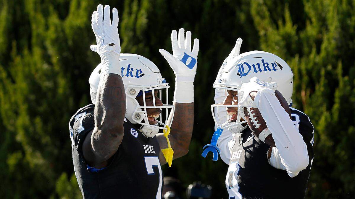 Duke’s Jordan Moore, left, celebrates with teammate Jordan Waters after he scored a touchdown during the first half of the Blue Devils’ game against Pittsburgh on Saturday, Nov. 25, 2023, at Wallace Wade Stadium in Durham, N.C.