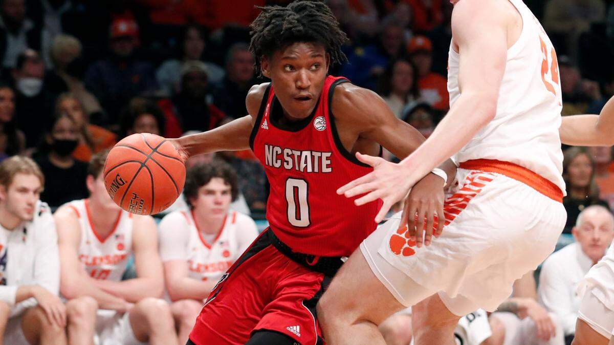 N.C. State’s Terquavion Smith (0) drives around Clemson’s PJ Hall (24) during the first half of N.C. State’s game against Clemson in the first round of the ACC men’s basketball tournament at the Barclays Center in Brooklyn, N.Y., Tuesday, March 8, 2022.
