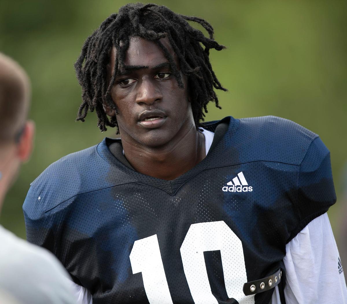 Lee County’s Desmond Evans (10) listens to directions from his coaches during practice on Saturday, August 3, 2019 at Lee County High School in Sanford, N.C.