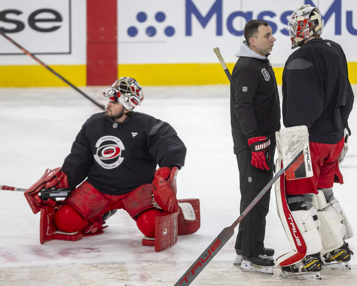 Carolina Hurricanes goaltending coach Paul Schonfelder talks with goalie Brandon Bussi (32) during practice on Monday, June 8, 2026 at T-Mobile Arena in Las Vegas, NV.