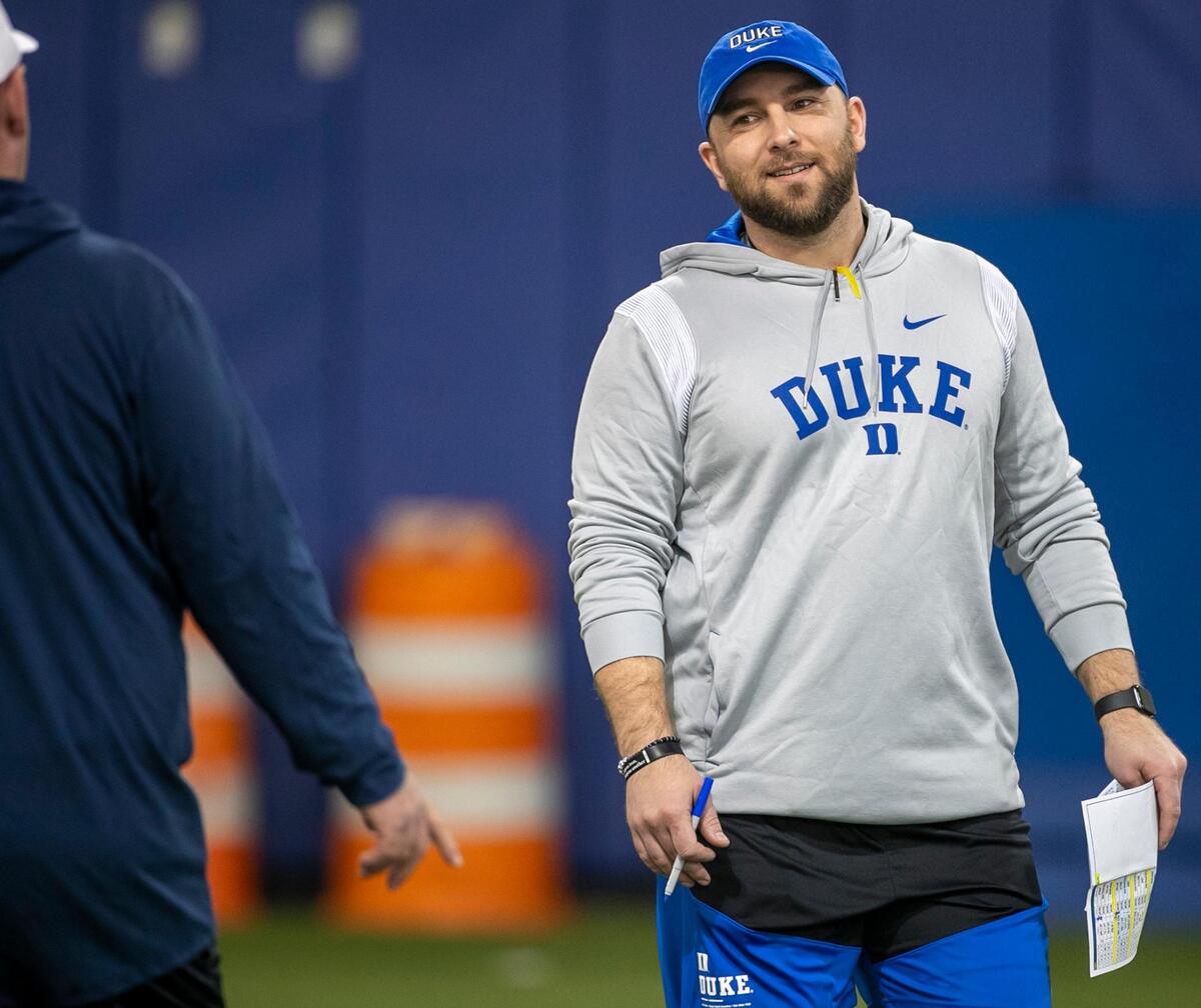 Duke defensive coordinator Tyler Santucci talks with head coach Mike Elko during the Blue Devils’ spring practice on Friday, March 24, 2023 in Durham, N.C.