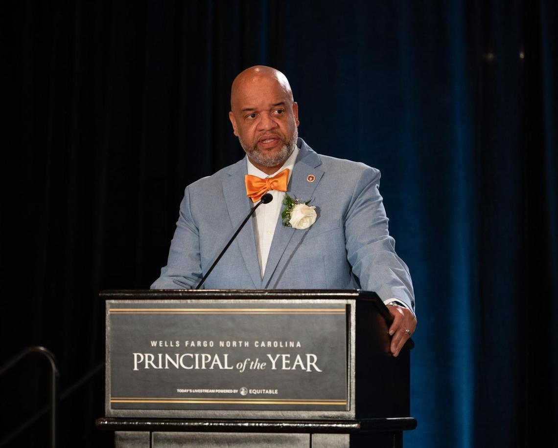 Jason Johnson, principal of Orange High School in Hillsborough, NC, accepts the 2025 Principal of the Year award in May 2025. Johnson plans to take a message of truth in education and support for students, staff and public schools across the state next school year.
