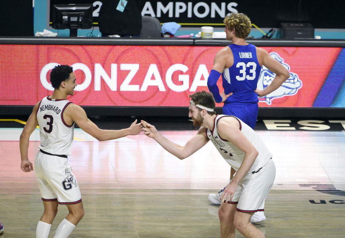 Gonzaga guard Andrew Nembhard (3) and forward Drew Timme (2) celebrate after they defeated BYU for the West Coast Conference men’s tournament championship Tuesday, March 9, 2021, in Las Vegas.
