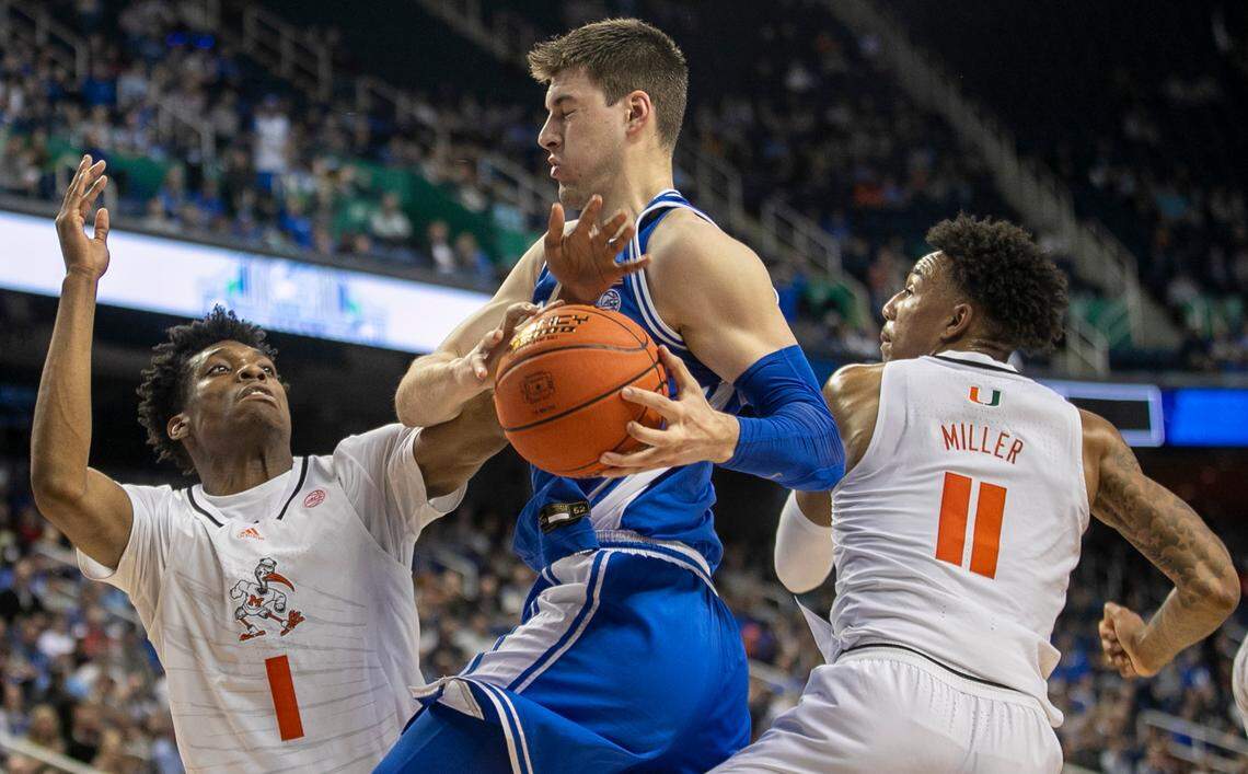 Duke’s Kyle Filipowski (30) secures a defensive rebound against Miami’s Anthony Walker (1) and Jordan Miller (11) in the second half during in the semi-finals of the ACC Tournament on Friday, March 10, 2023 at the Greensboro Coliseum in Greensboro, N.C.