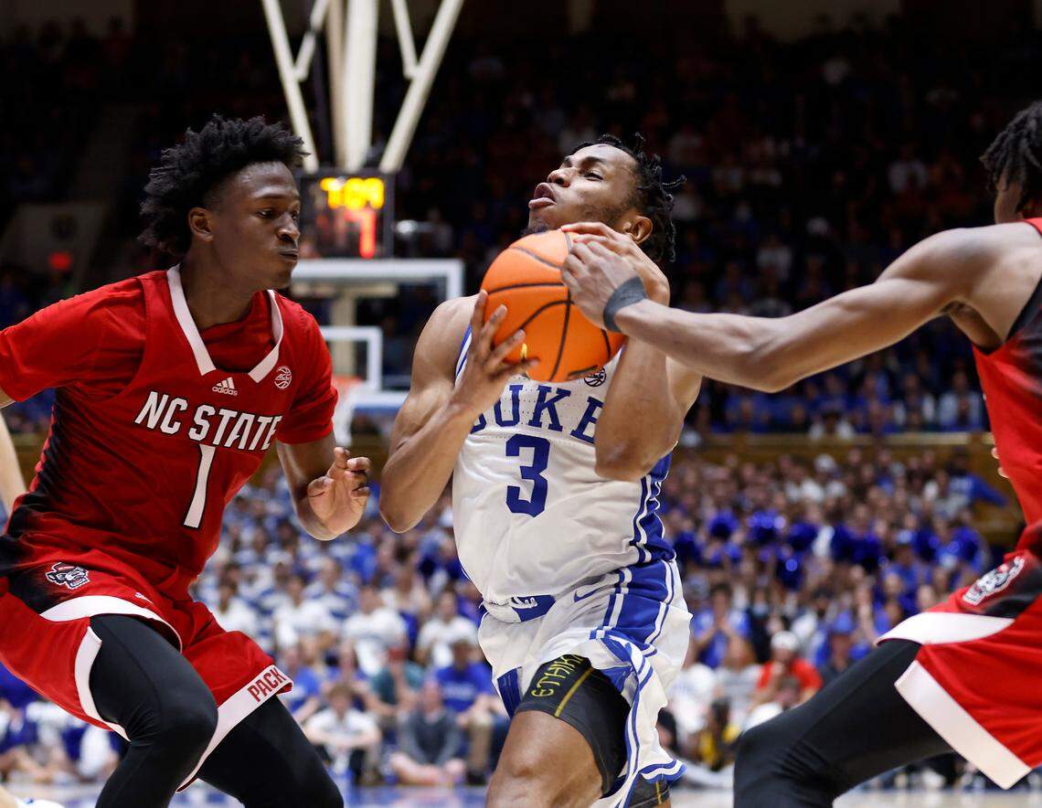 Duke’s Jeremy Roach pushes the ball past N.C. State’s Jarkel Joiner and Terquavion Smith during the second half of Duke’s 71-67 win over N.C. State on Tuesday, Feb. 28, 2023, at Cameron Indoor Stadium in Durham, N.C.