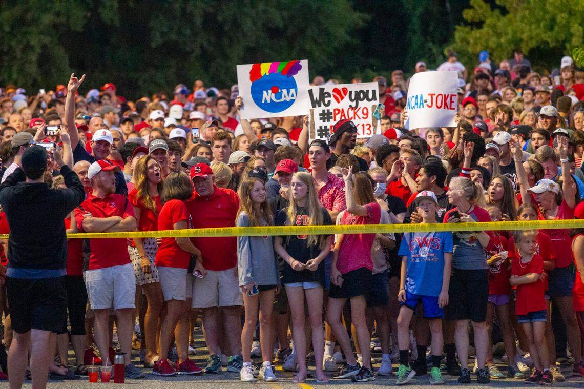 N.C. Sate baseball fans wait outside Doak Field at Dail Park while waiting to greet the team as they returned from Omaha, Nebraska Saturday, June 26, 2021 after NCAA protocol, forced the them out of the College World Series.