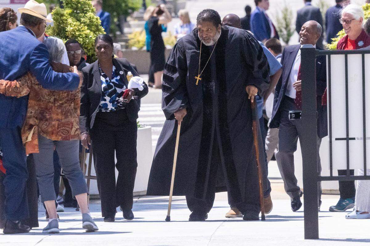 Rev. William Barber II lheads into the Legislative Building in Raleigh Wednesday, May 24, 2023 to lead a protest rally. Barber and the demonstrators called for the Republican-led legislature to amend its budget proposals.