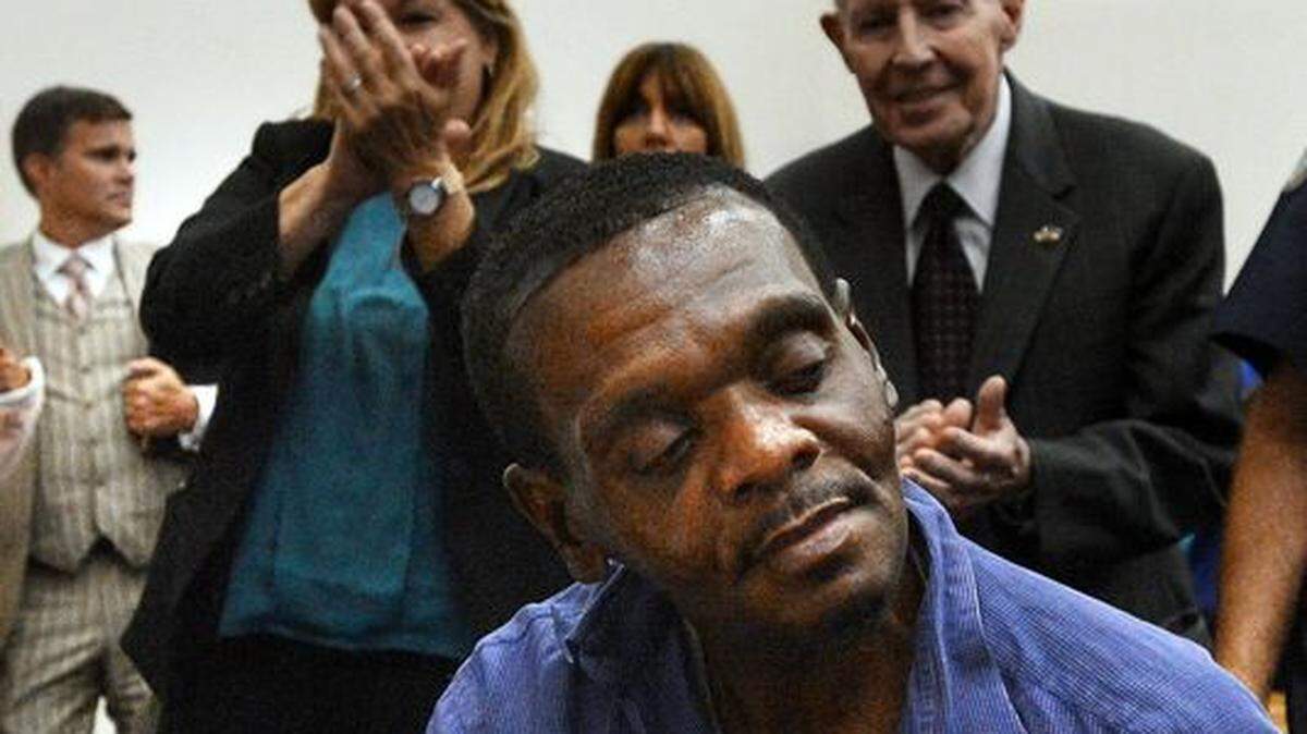 Henry McCollum sits stunned as applause rings out in a Robeson County courtroom in Lumberton, on Sept. 2, 2014 after a judge declared him and his brother Leon Brown innocent of a brutal rape murder that occurred in 1983. McCollum spent more than 30 years on North Carolina’s death row before being exonerated based on DNA evidence.