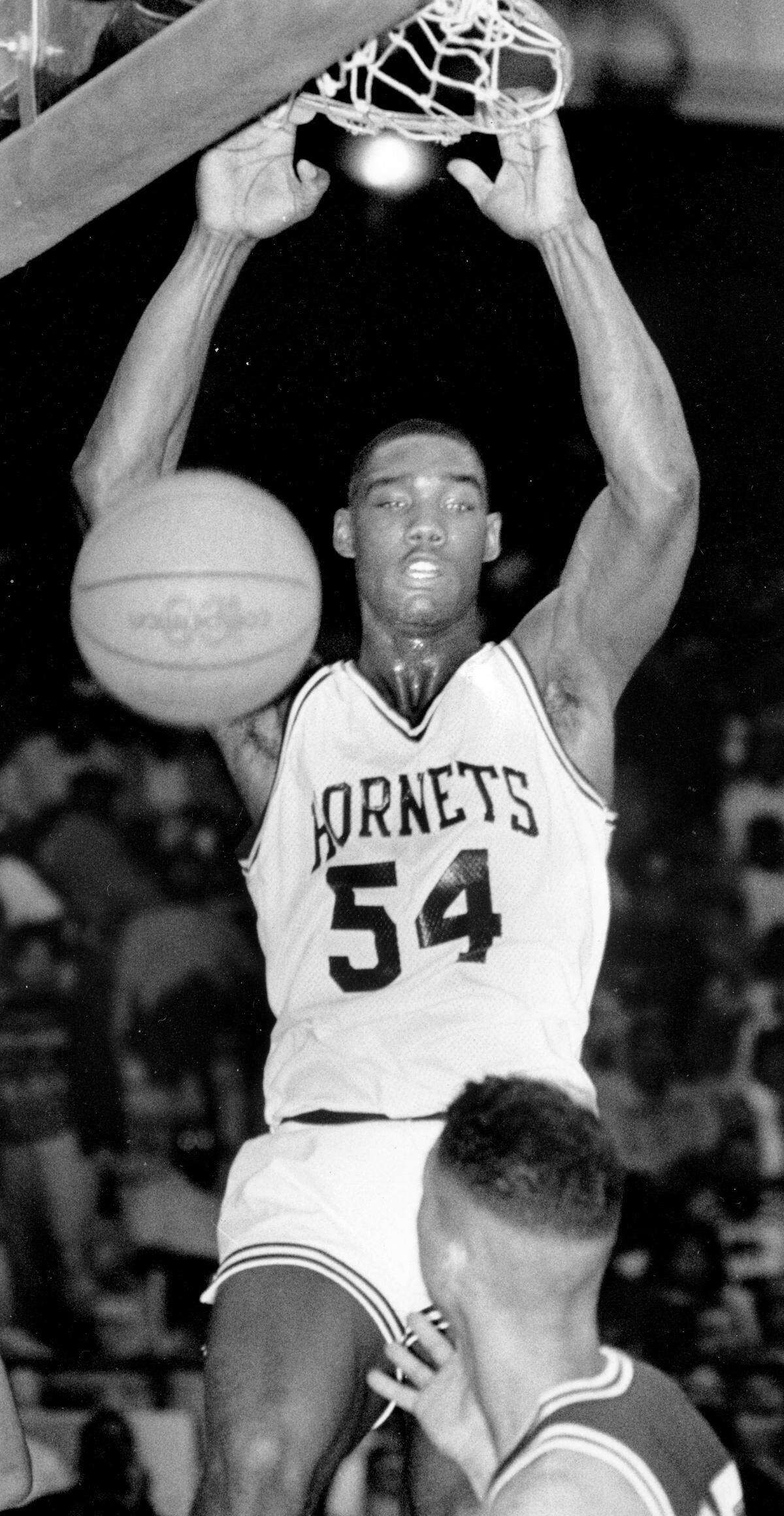 Rodney Rogers dunks in the first quarter against Vance High School on March 2, 1990.