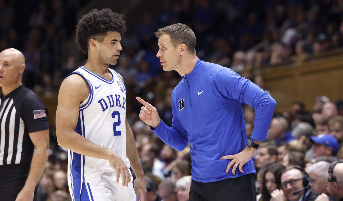 Duke head coach Jon Scheyer talks to Cayden Boozer (2) during the second half of Duke’s 96-71 exhibition victory over UCF at Cameron Indoor Stadium in Durham, N.C., Tuesday, Oct. 21, 2025.