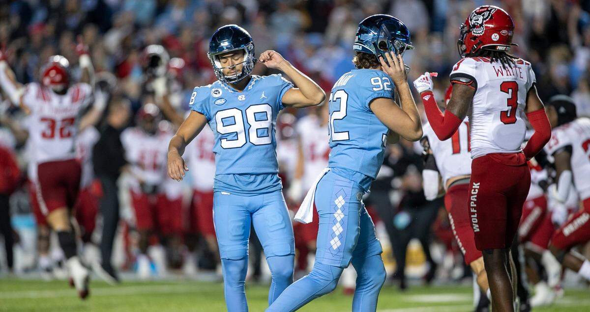 North Carolina kicker Noah Burnette (98) reacts after missing a 35-yard field goal attempt in overtime to give N.C. State a 30-27 victory on Friday, November 25, 2022 at Kenan Stadium in Chapel Hill, N.C.