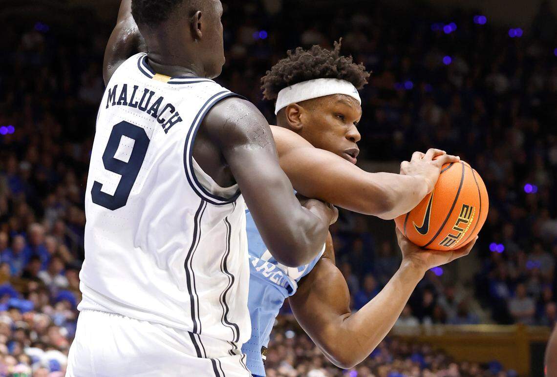 North Carolina’s Ven-Allen Lubin (22) tries to get around Duke’s Khaman Maluach (9) during the first half of Duke’s game against UNC at Cameron Indoor Stadium in Durham, N.C., Saturday, Feb. 1, 2025.