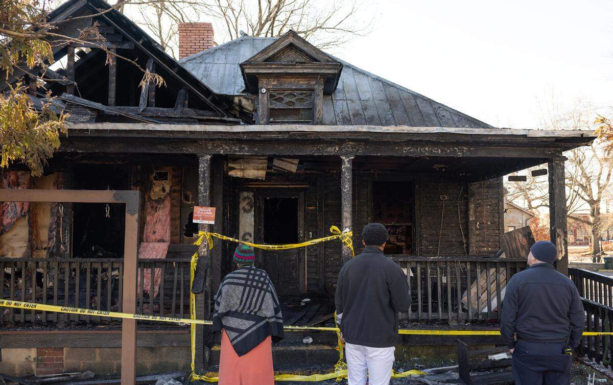 Board members and an investigator view the damage after fire badly damaged the House of Art on East Hargett Street near Moore Square in downtown Raleigh, early Tuesday morning on Jan. 7, 2025.