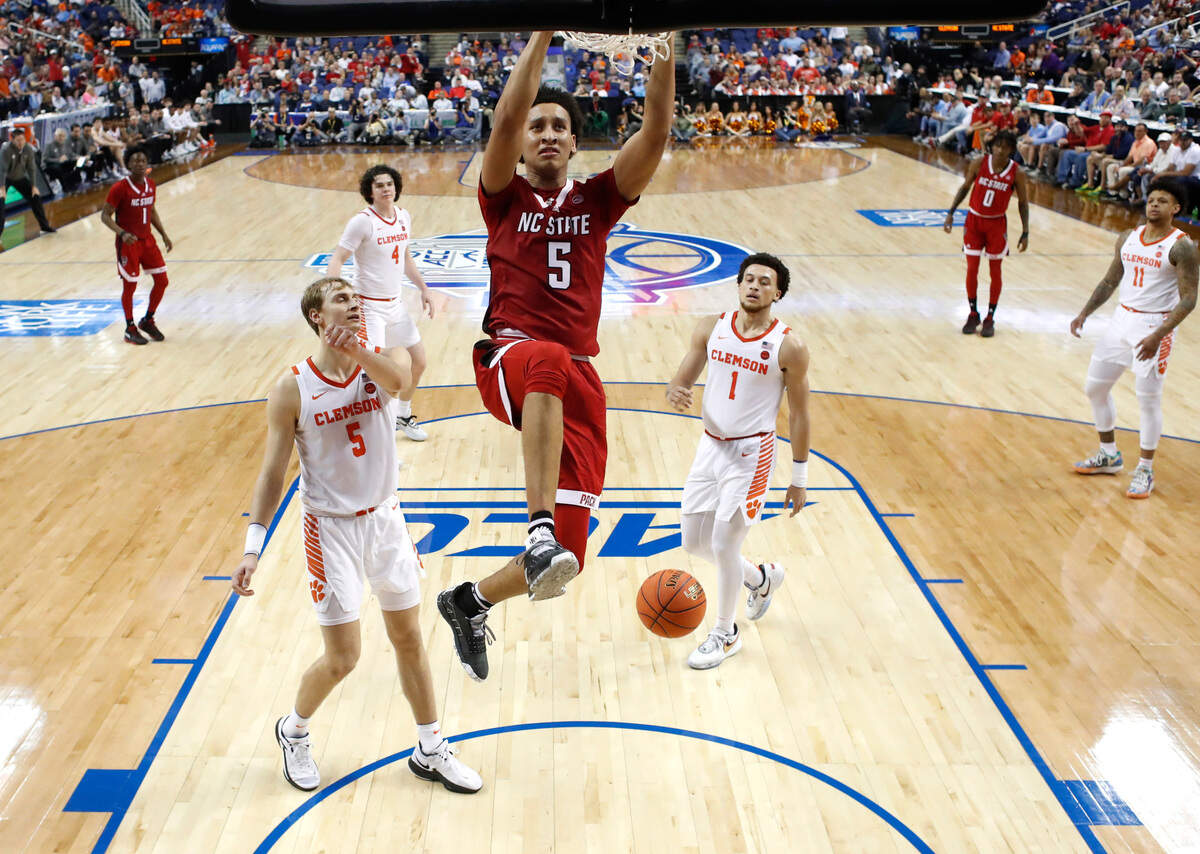 N.C. State’s Jack Clark (5) slams in two during Clemson’s 80-54 victory over N.C. State in the quarterfinals of the ACC Men’s Basketball Tournament in Greensboro, N.C., Thursday, March 9, 2023.