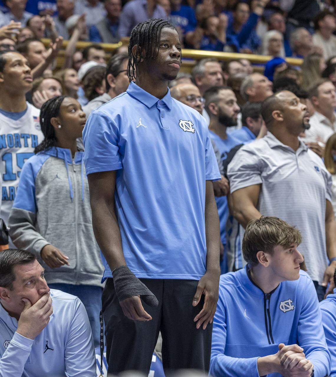 North Carolina forward Caleb Wilson (8), out with a broken thumb, watches the first half against Duke on Saturday, March 7, 2026 at Cameron Indoor Stadium in Durham, N.C.