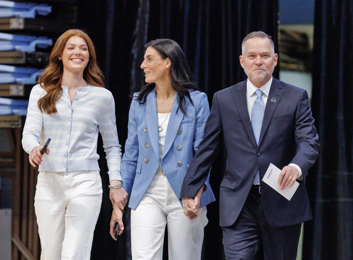 New North Carolina men’s basketball head coach Michael Malone arrives with his daughter, Bridget, and wife, Jocelyn, to an introductory press conference at the Smith Center on Tuesday, April 7, 2026, in Chapel Hill, N.C. 