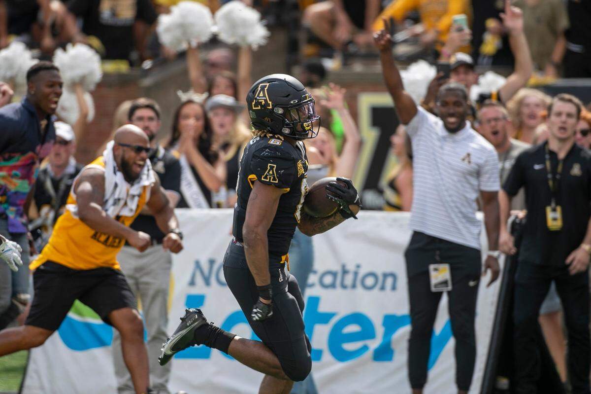 The Appalachian States Camerun Peoples (6) scores on a 38-yard run in the fourth quarter to tie North Carolina 49-49 on Saturday, September 3, 2022 at Kidd Brewer Stadium in Boone, N.C.