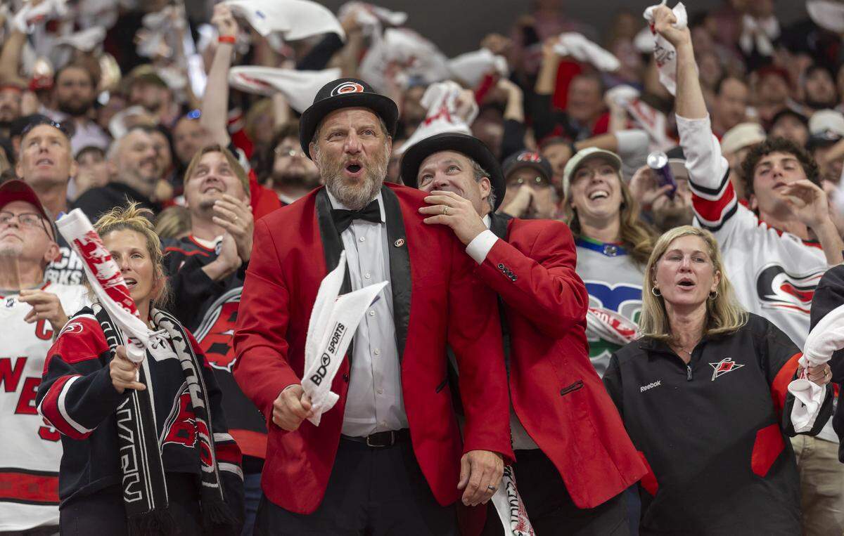Hurricanes fans celebrate after a first period goal by left wing Taylor Hall to take a 1-0 lead in the first period during Game 5 of the Eastern Conference Finals on Friday, May 29, 2026 at Lenovo Center in Raleigh, N.C.