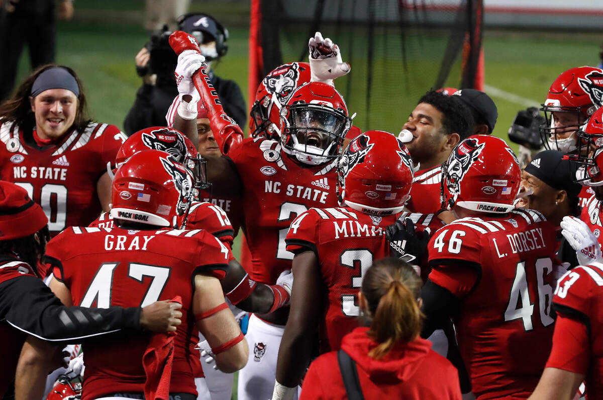 N.C. State linebacker Jaylon Scott (2) celebrates with the ‘Turnover Bone’ after making an interception during the second half of N.C. State’s 31-20 victory over Duke at Carter-Finley Stadium in Raleigh, N.C., Saturday, Oct. 17, 2020.