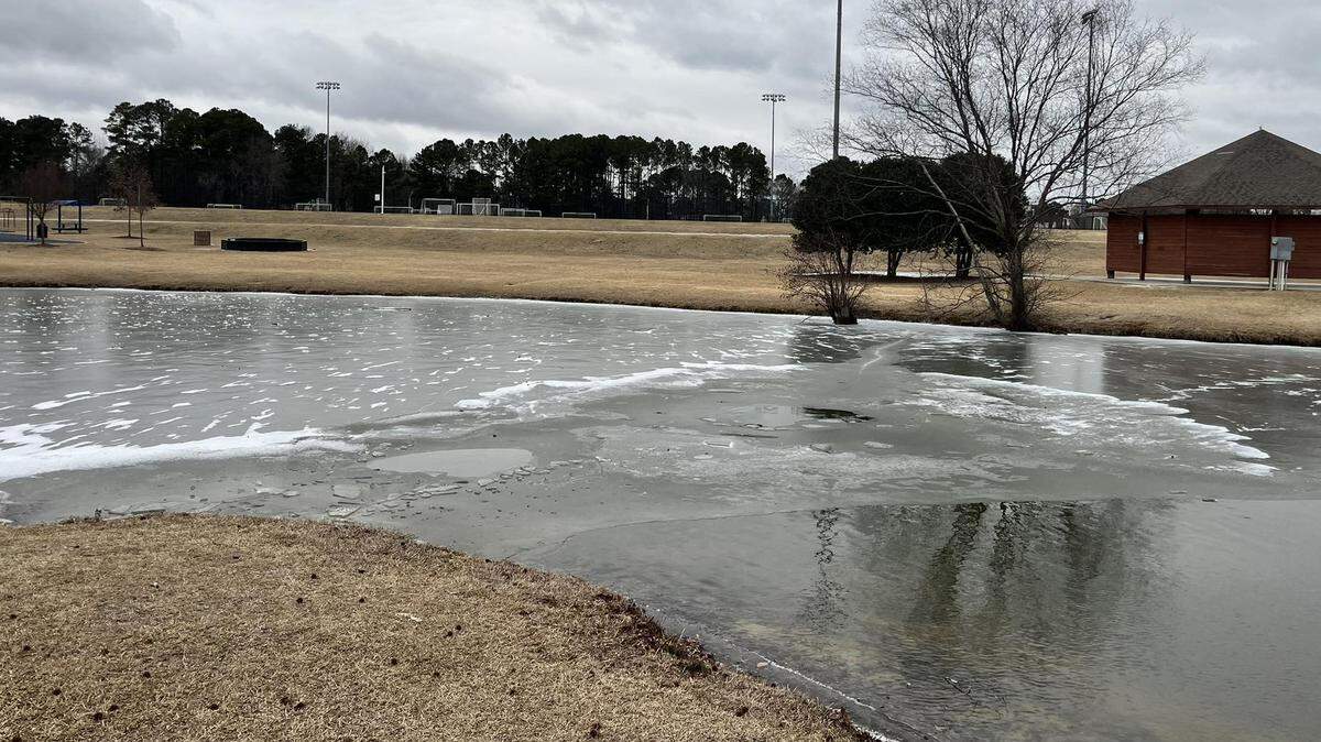 An 11-year-old boy was rescued by a Holly Springs Police officer after falling into an iced over pond.