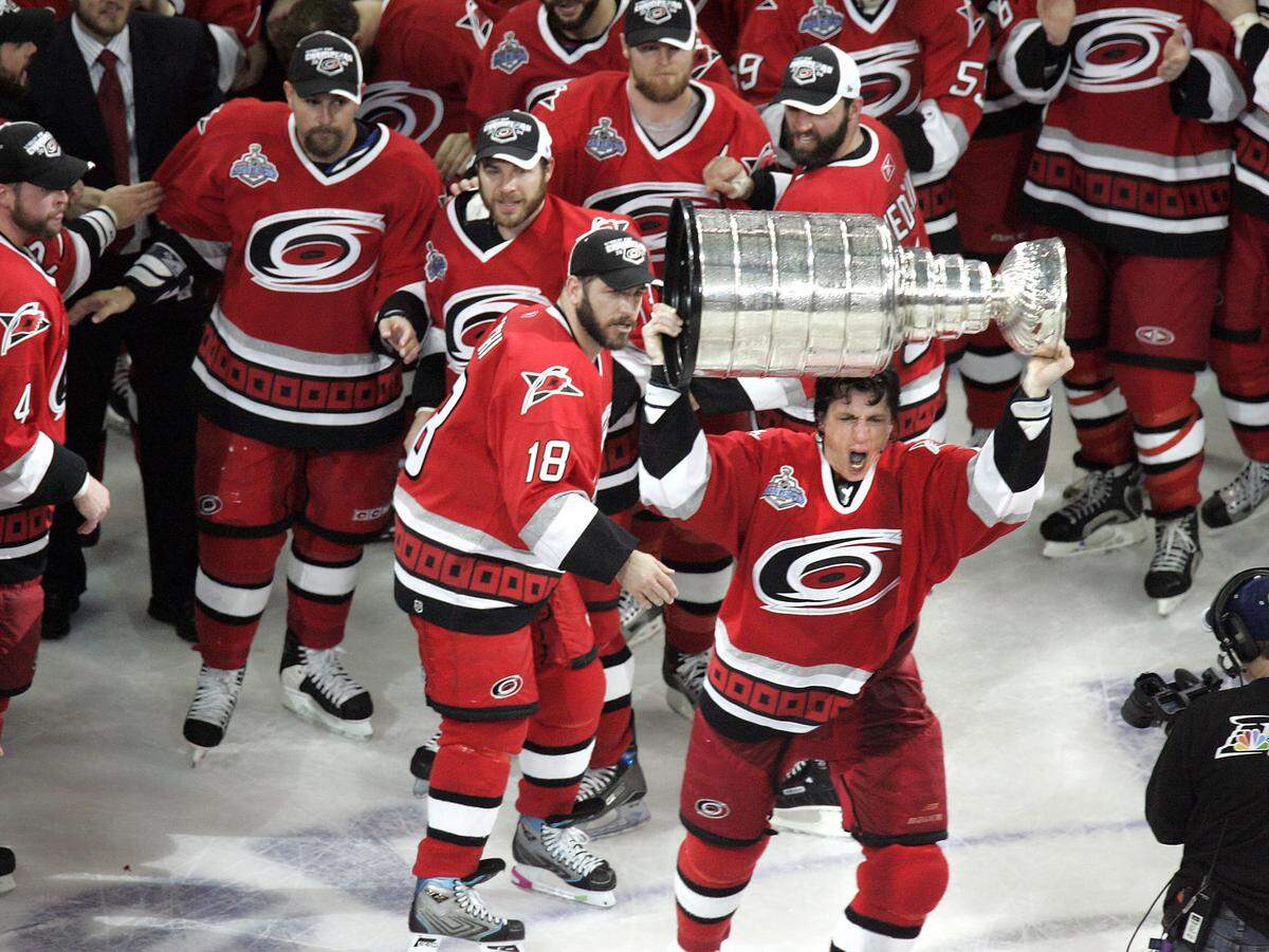 A 2006 photo shows Rod Brind’Amour hoisting the Stanley Cup as he and his teammates celebrate defeating the Edmonton Oilers to win the Stanley Cup Championship.