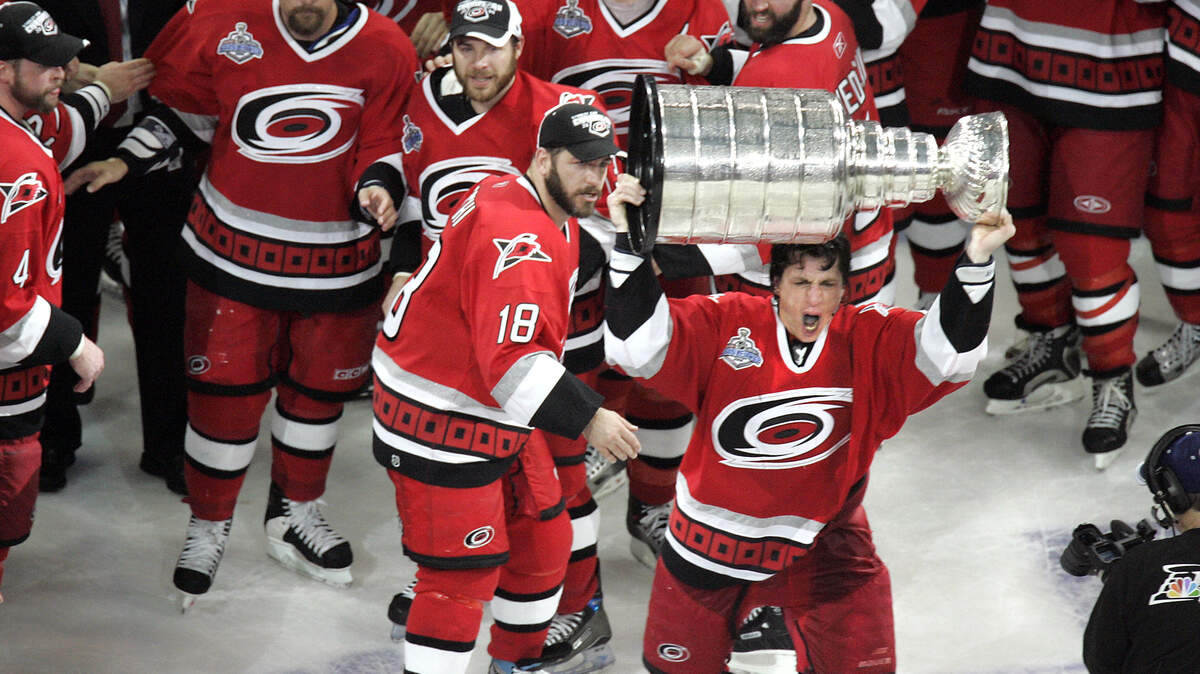 Rod Brind’Amour hoists the Stanley Cup as he and his Hurricanes’ teammates celebrate after beating the Edmonton Oilers in 2006.