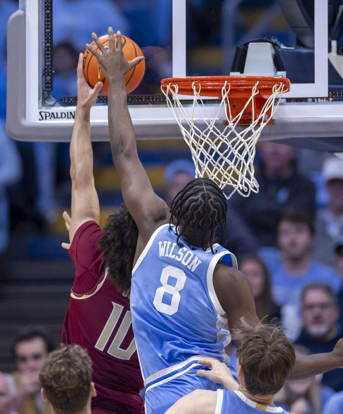 North Carolina forward Caleb Wilson (8) blocks a shot by Florida State’s Lajae Jones (10) in the second half on Tuesday, December 30, 2025 at the Smith Center in Chapel Hill, N.C.