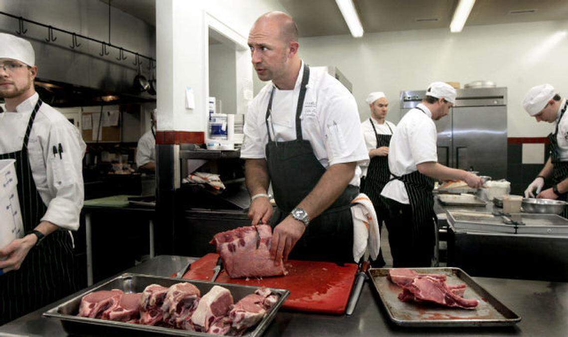 Fearrington House’s then-Executive Chef Colin Bedford, working in the kitchen with 9 other members of his staff in preparation for dinner.