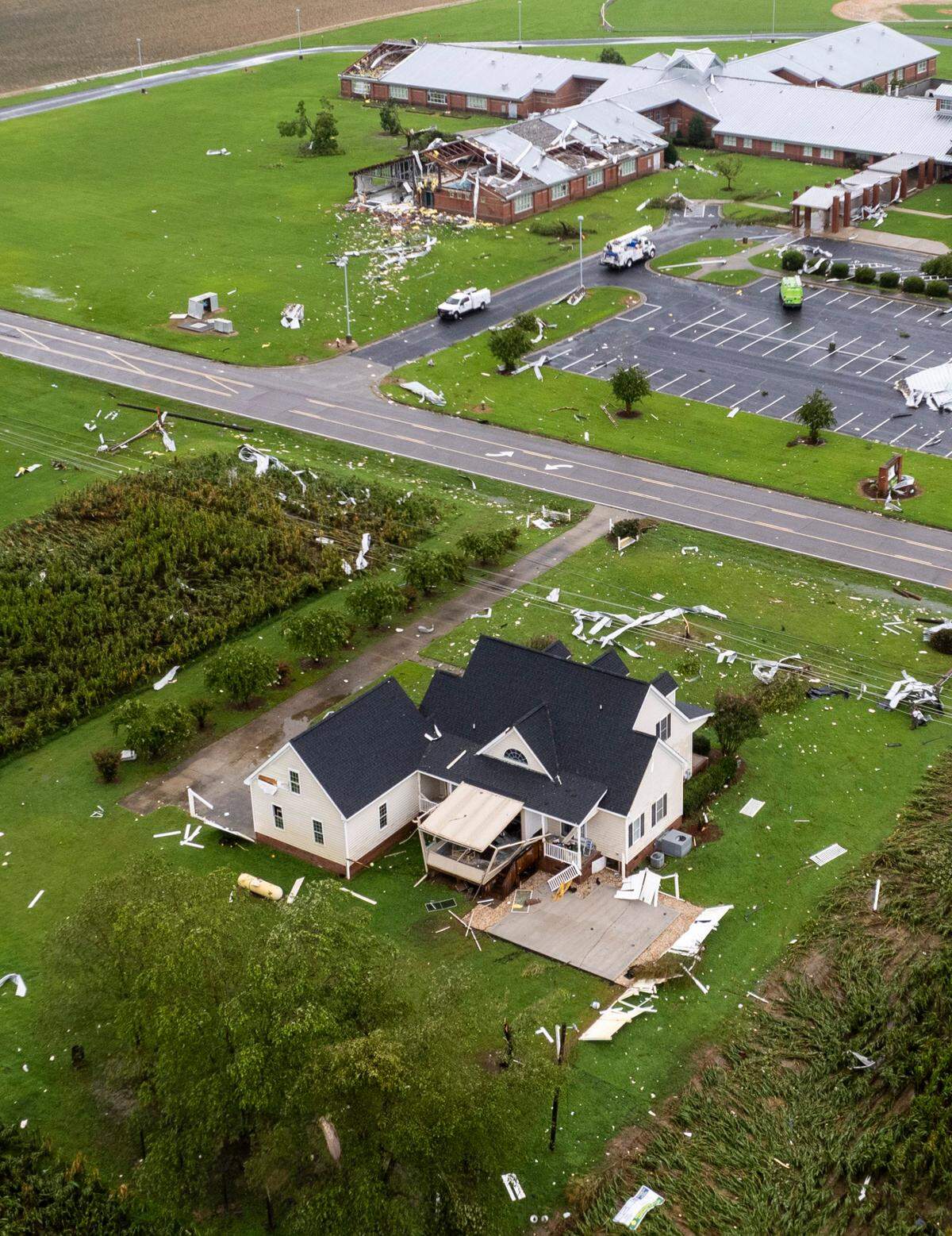 Debris from the heavily damaged Springfield Middle School near Lucama are spread across fields after a tornado damaged the school and at least 10 homes as bands from Tropical Storm Debbie moved through the area on Thursday, Aug. 8, 2024. At least one person is dead as a result of the tornado.