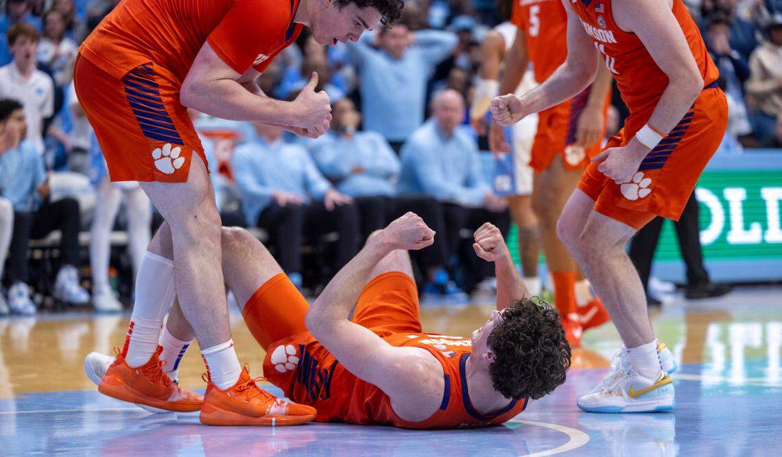 Clemson’s P.J. Hall (24) reacts after taking a charge from North Carolina’s Armando Bacot (5) in the second half on Tuesday, February 6, 2024 at the Dean E. Smith Center in Chapel Hill, N.C. Hall led all scores with 25 points in the Tigers’ 80-76 victory.