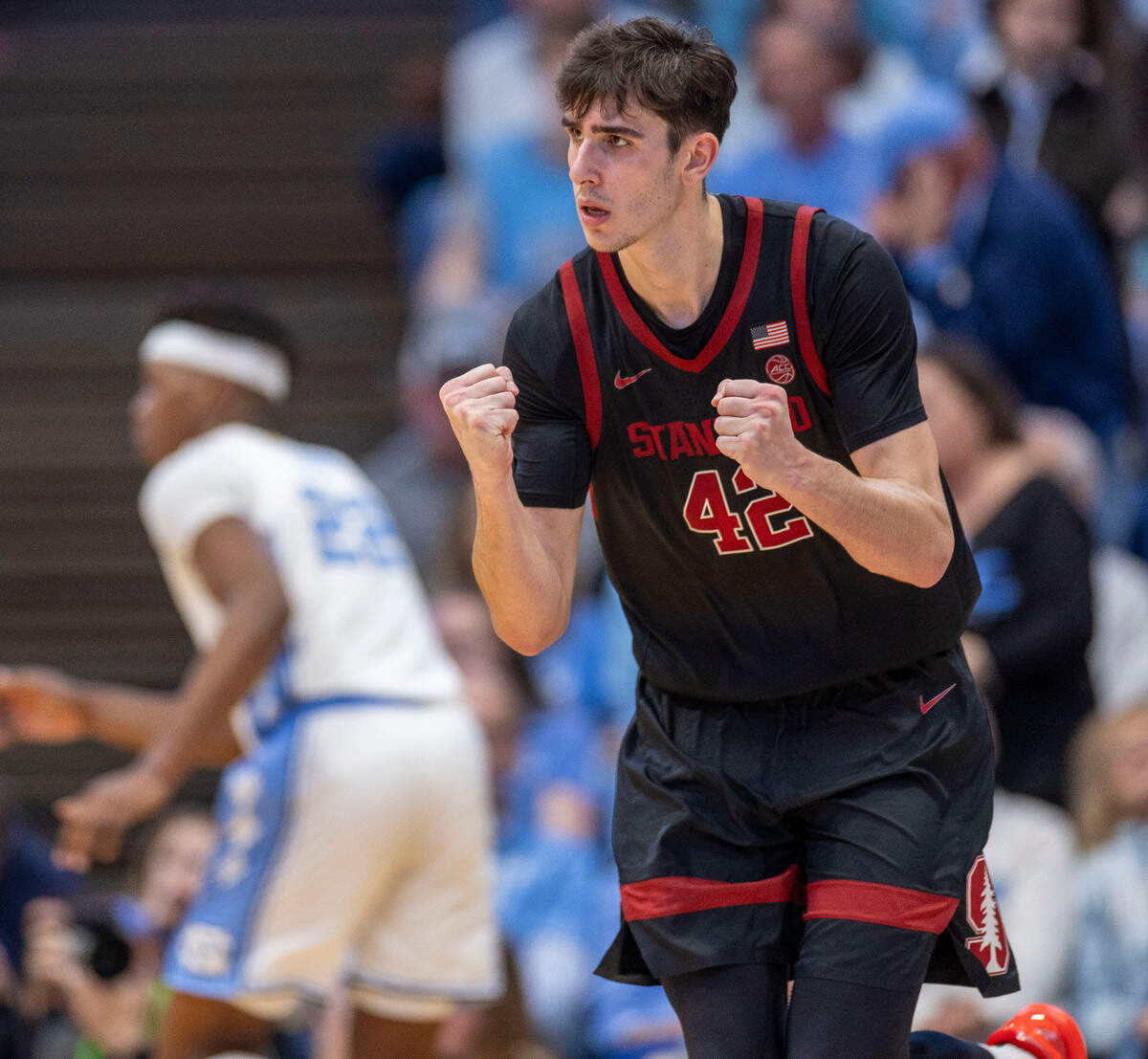 Stanford forward Maxime Raynaud (42) reacts after sinking a three-point basket to cut the North Carolina lead to one point with two minutes to play against North Carolina on Saturday, January 18, 2025 at the Smith Center in Chapel Hill, N.C. Raynaud lead all scores with 25 points in the Cardinals’ 72-71 victory.