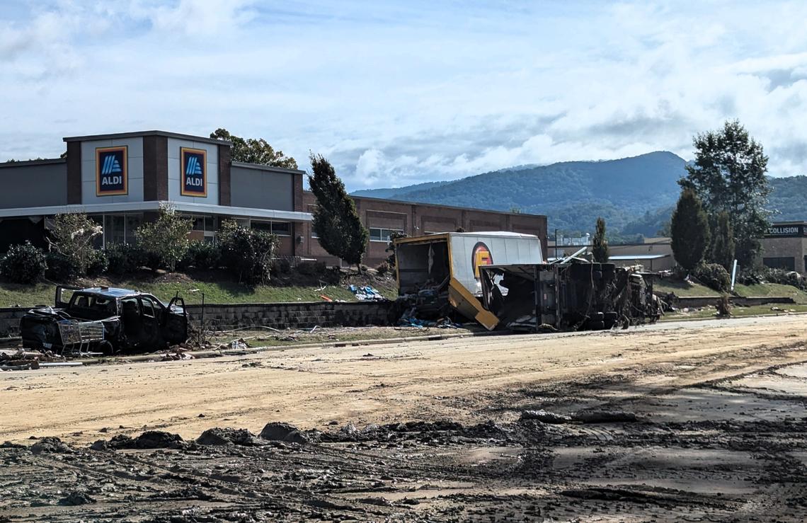 Chapel Hill Police Department officers are helping the Asheville Police Department cover some shifts, answering calls and managing traffic on roads that remain hard to navigate, like this strip of U.S. 74 Business near the Swannanoa River.