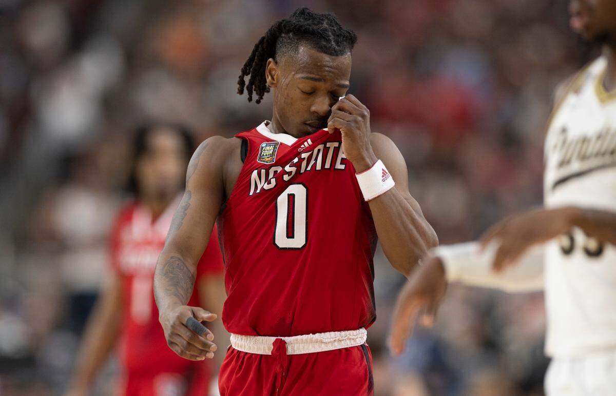 Down by 12 points, N.C. State’s D.J. Horne (0) reacts after missing a three-point attempt with 5:03 to play against Purdue in the NCAA Final Four National Semifinal on Saturday, April 6, 2024 at State Farm Stadium in Glendale, AZ. Purdue defeated N.C. State 63-53.