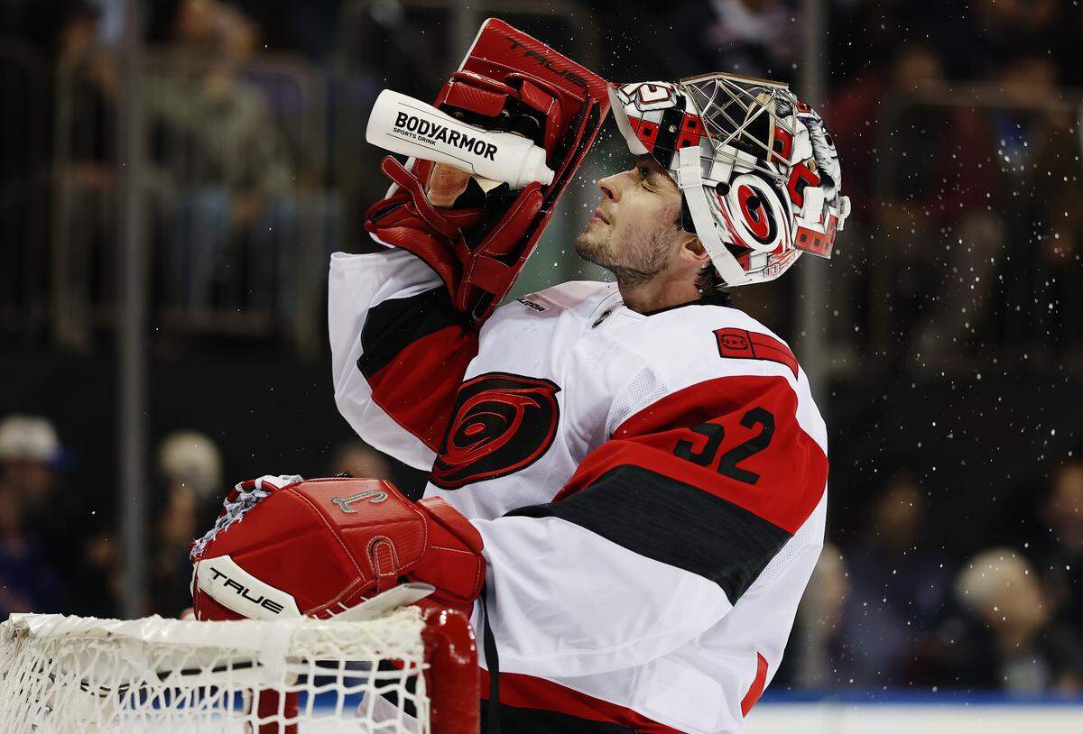 Pyotr Kochetkov of the Carolina Hurricanes drinks water during the second period against the New York Rangers at Madison Square Garden on Nov. 4, 2025 in New York City. 