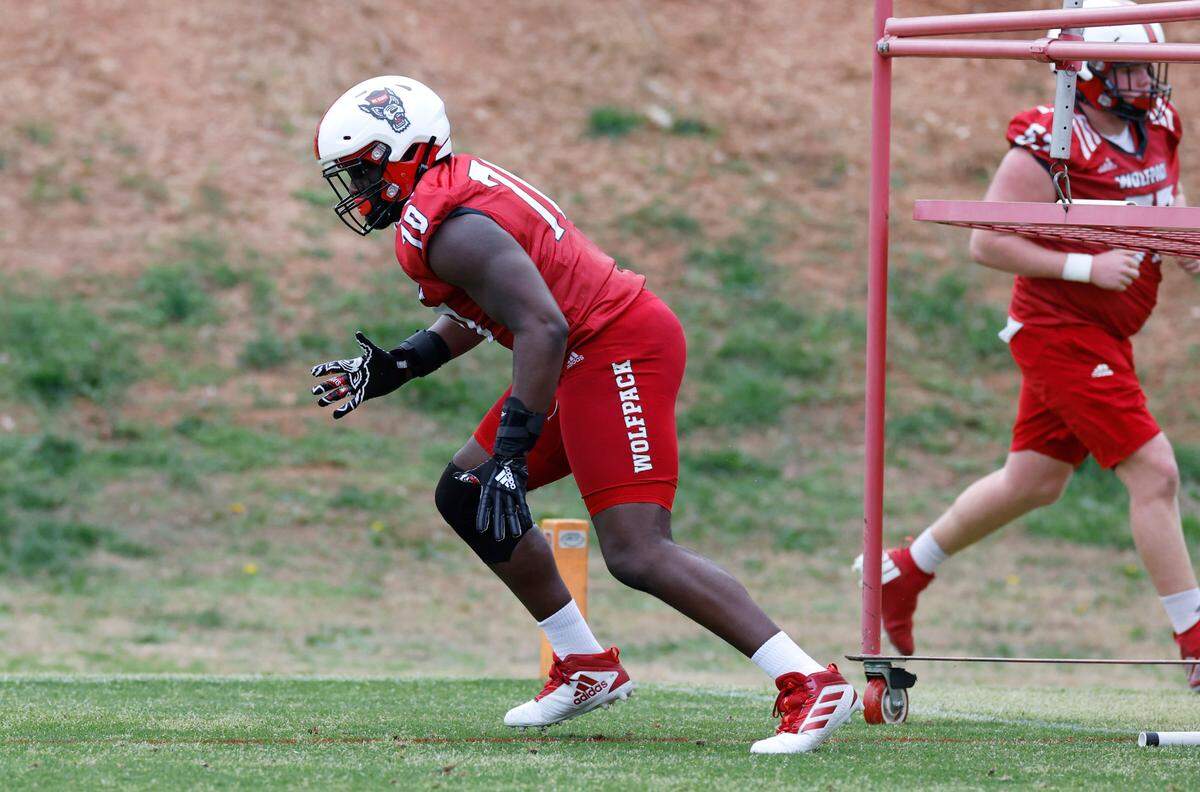 N.C. State offensive lineman Obidiah ‘Obi’ Obasuyi (70) runs a drill during the Wolfpack’s first spring practice in Raleigh, N.C., Wednesday, March 1, 2023.