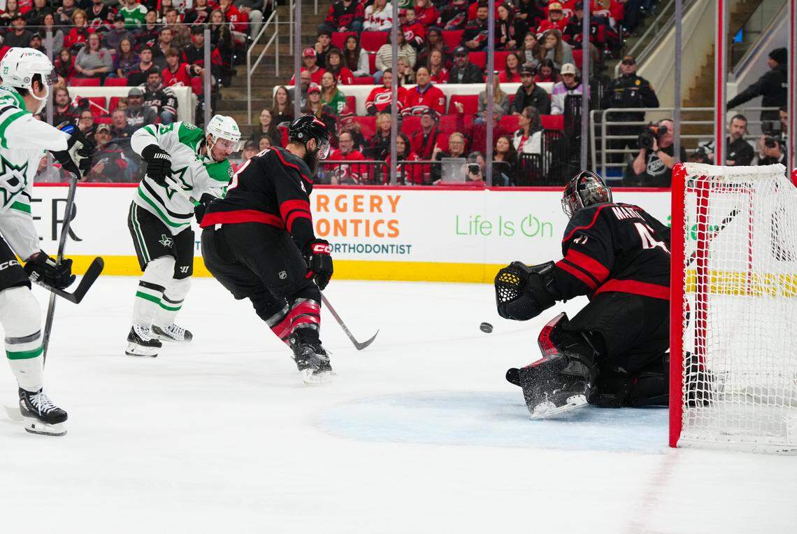 Dallas Stars center Matt Duchene (95) takes a shot against Carolina Hurricanes goaltender Spencer Martin (41) and defenseman Brent Burns (8) during the second period at Lenovo Center.
