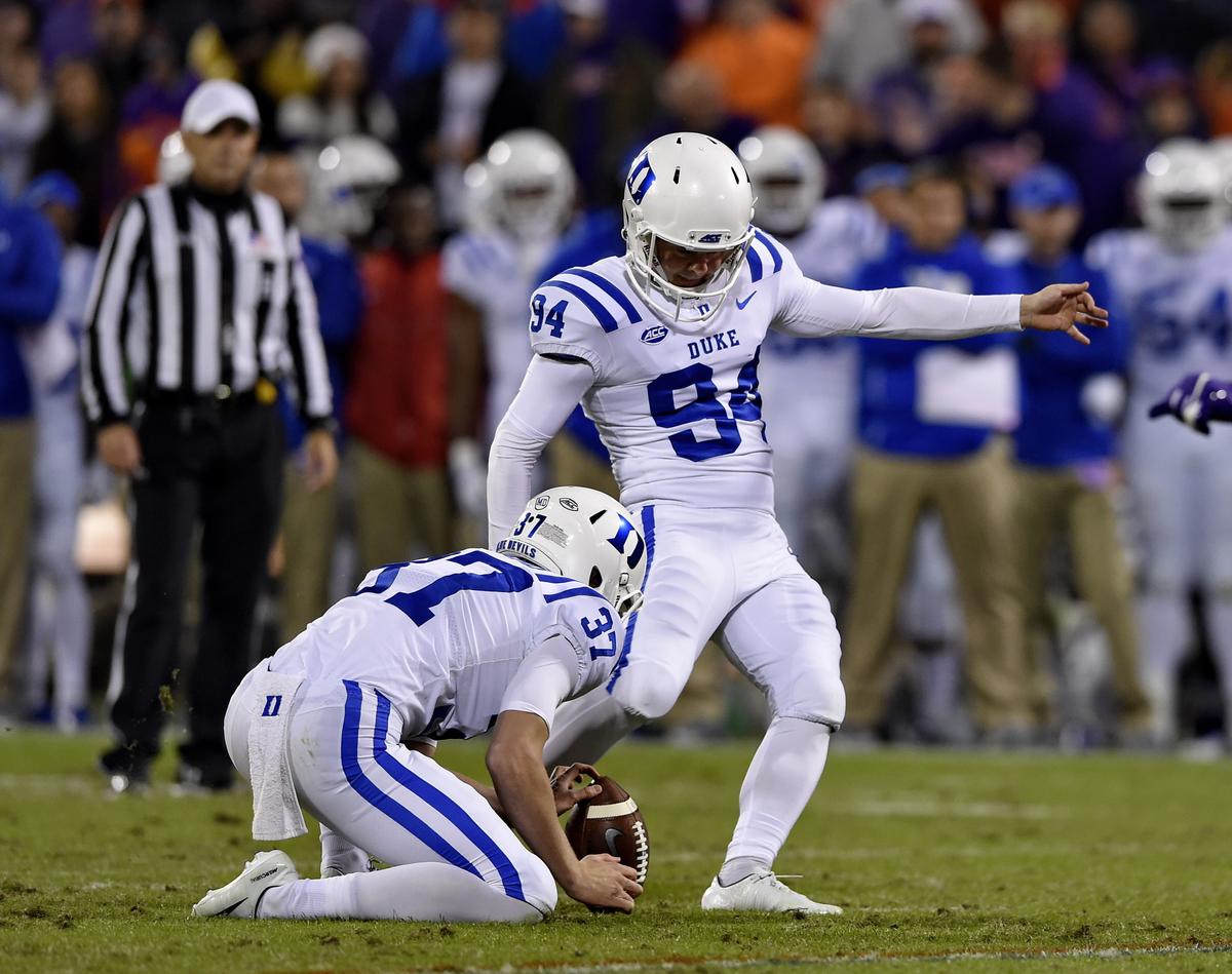 Duke kicker Collin Wareham (94) kicks his second field goal of the night, with Jackson Hubbard holding during the first half against Clemson on Saturday, Nov. 17, 2018, in Clemson, S.C. (AP Photo/Richard Shiro)