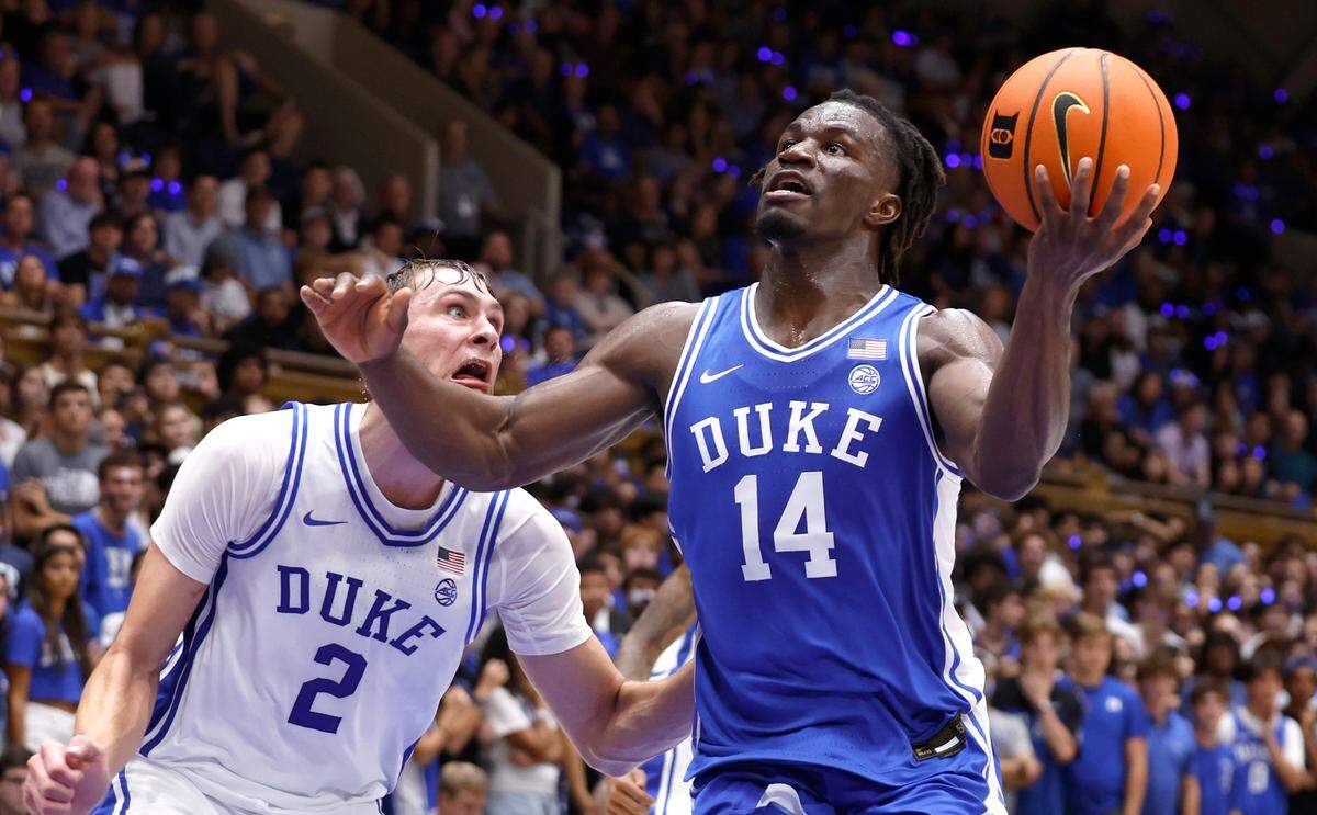 Duke’s Sion James (14) drives to the basket past Cooper Flagg (2) during a scrimmage during the Blue Devils’ Countdown to Craziness at Cameron Indoor Stadium in Durham, N.C., Friday, Oct. 4, 2024.