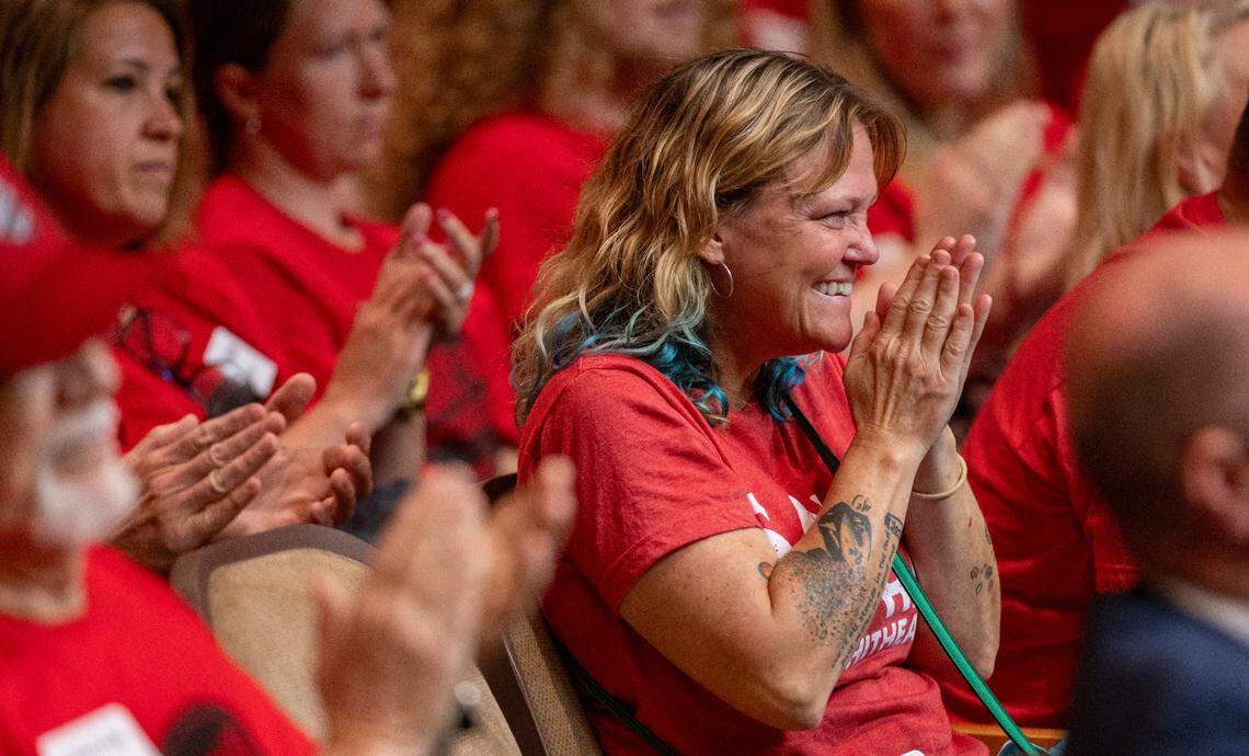Karissa Kramer, a bartender at the Berkley Cafe, reacts after the Raleigh City Council voted to close South Street to make way for a new Red Hat Amphitheater on Tuesday, Sept. 17, 2024.