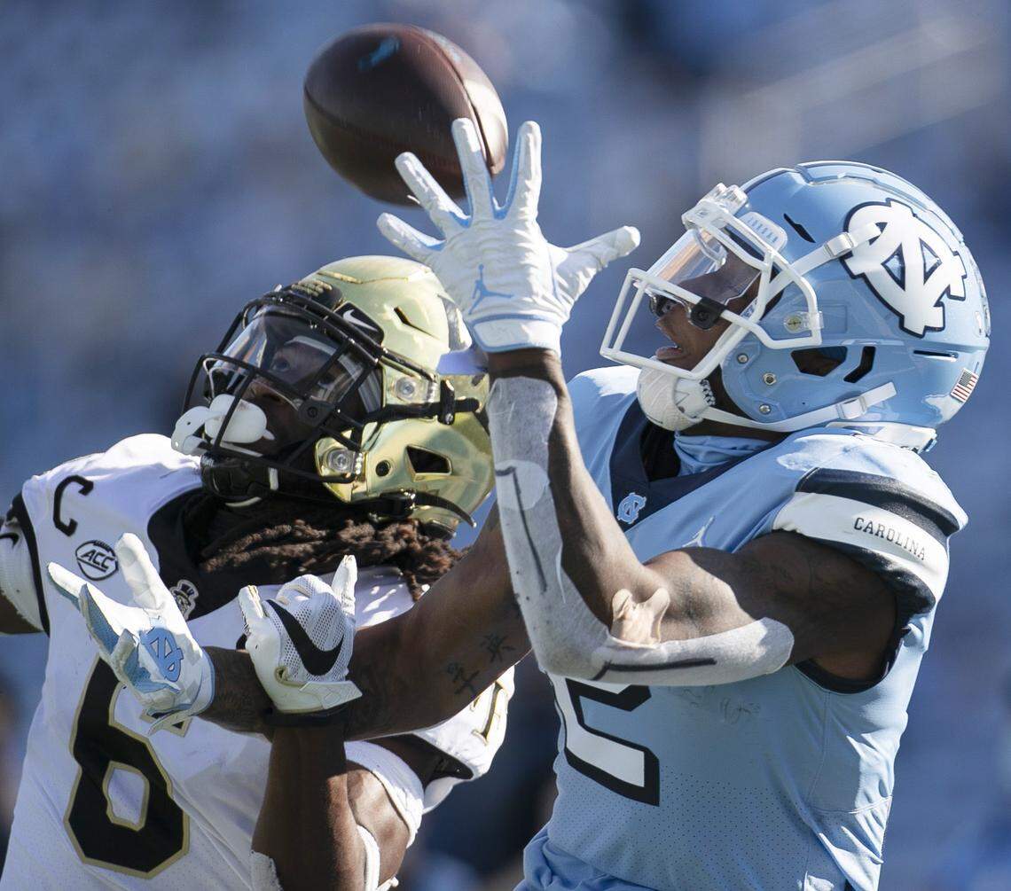 Wake Forest defense back Ja’Sir Taylor (6) defends North Carolina’s Dyami Brown (2) in the second quarter at Kenan Stadium on Saturday, November 14, 2020 in Chapel Hill, N.C. Taylor intercepted the pass.
