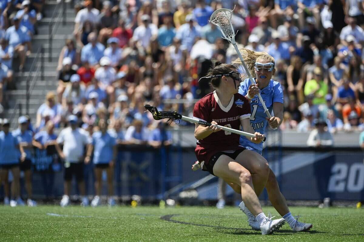 North Carolina midfielder Emily Nalls (1), right, guards against Boston College attack Charlotte North (8) during the NCAA college Division 1 women’s lacrosse championship in Baltimore, Sunday, May 29, 2022. (Vincent Alban/The Baltimore Sun via AP)