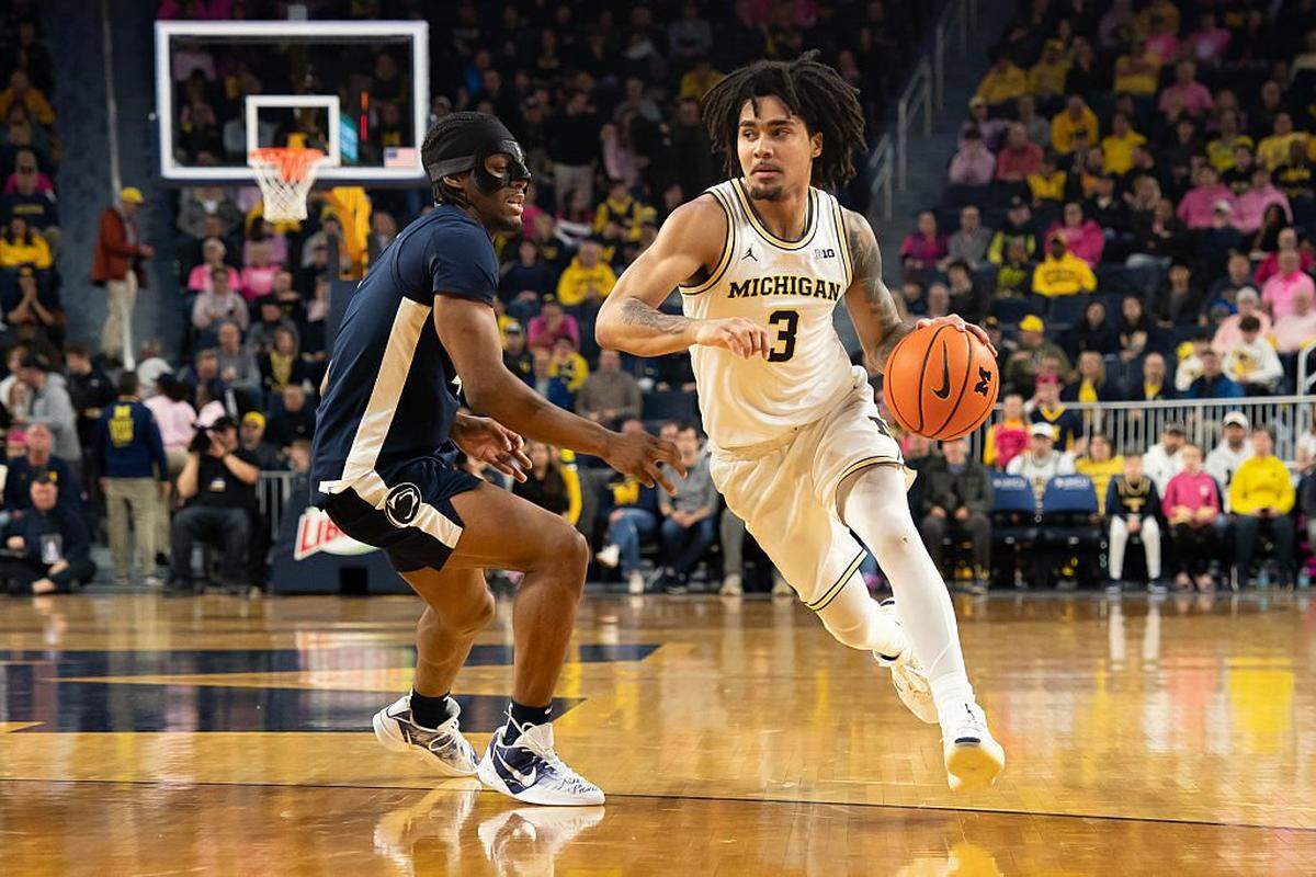 ANN ARBOR, MICHIGAN - FEBRUARY 5: Elliot Cadeau #3 of the Michigan Wolverines drives against Kayden Mingo #4 of the Penn State Nittany Lions during the first half at Crisler Arena on February 5, 2026 in Ann Arbor, Michigan. (Photo by Jaime Crawford/Getty Images)