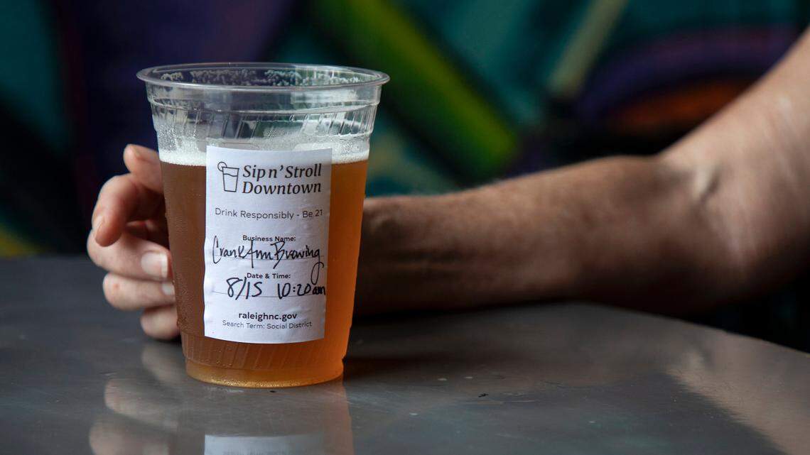 A sticker marks a social district drink at Crank Arm Brewing Company on Monday, August 15, 2022, in Raleigh, N.C.