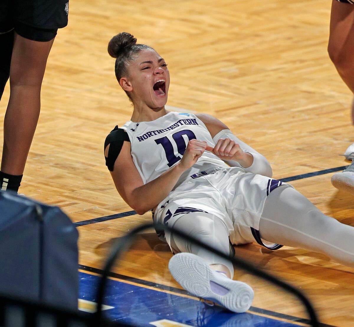Northwestern guard Lindsey Pulliam (10) reacts after a one and during the second half of a college basketball game in the first round of the women’s NCAA tournament at the Greehey Arena in San Antonio, Monday, March 22, 2021. 